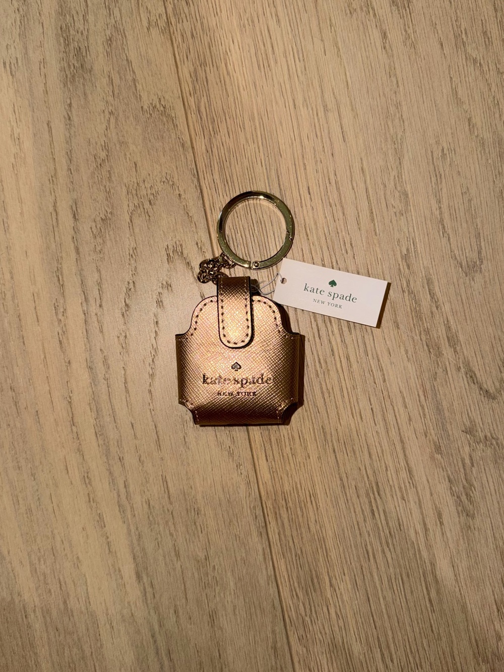 kate spade metallic rose gold AirPod holder